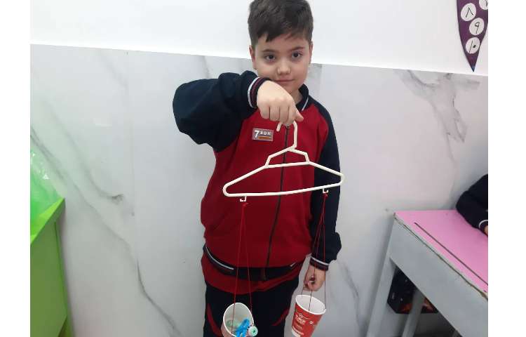 استفاده از ترازو برای مقایسه جرم اجسام 2