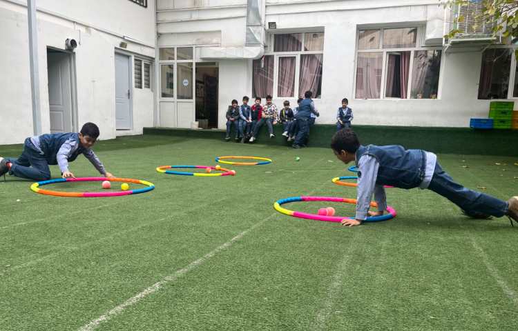 ریتم و گیم - کار با حلقه و توپ جهت تقویت عصب عضله و تعادل انجام شد 3