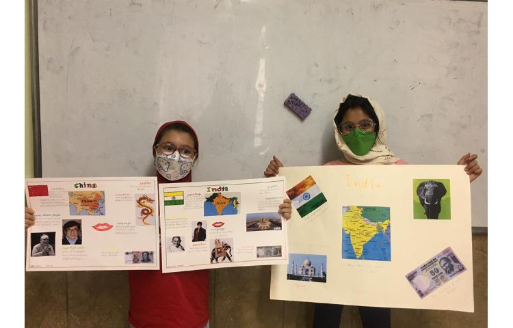 کارگروهی دانش آموزان در ساخت کاردستی مربوط به کشورها و پوستر دیواری آشنایی با فرهنگ ملل 7